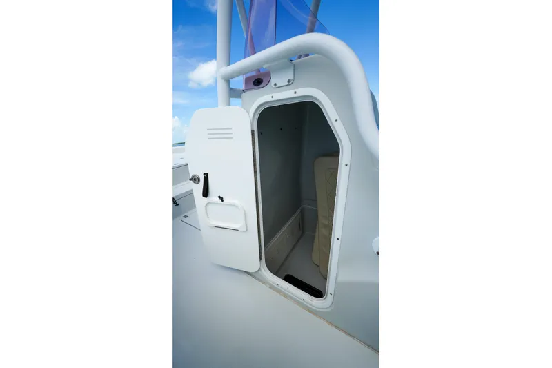 Slide: The Image of Open storage compartment on 2019 Blue Wave 2800 Pure Hybrid boat. - 33