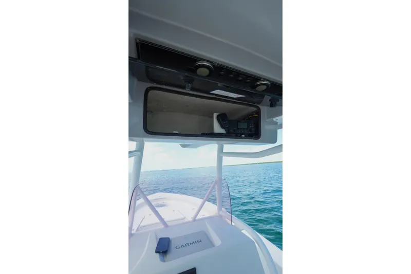Slide: The Image of 2019 Blue Wave 2800 Pure Hybrid boat console with Garmin equipment on open water. - 34
