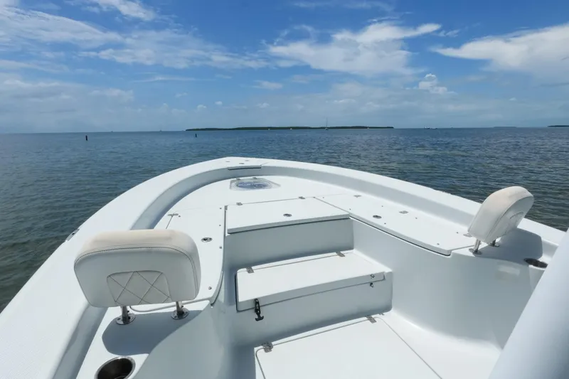Slide: The Image of 2019 Blue Wave 2800 Pure Hybrid boat on calm ocean waters under a clear sky. - 9