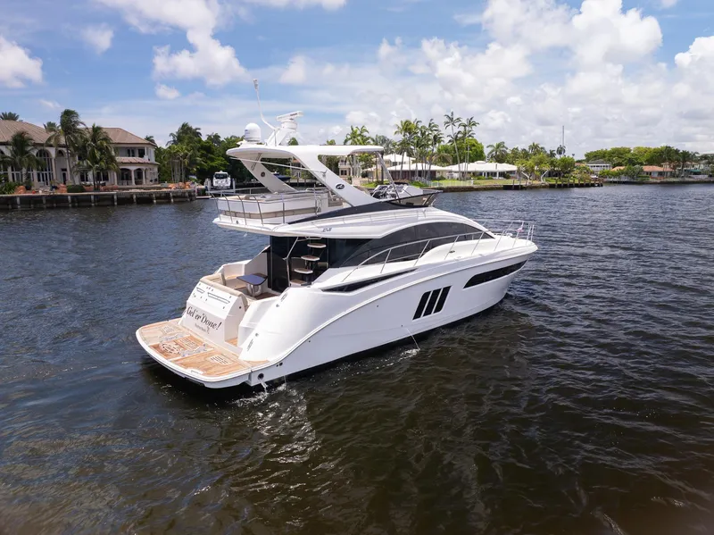 Slide: The Image of 2016 Sea Ray 510 Fly luxury yacht cruising on a sunny day. - 5