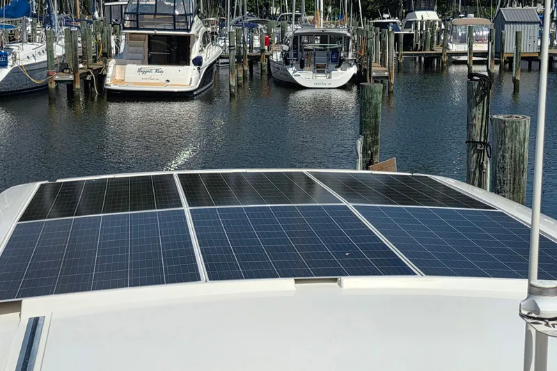 Slide: The Image of Solar panels on 2023 Greenline 40 yacht docked at marina. - 11