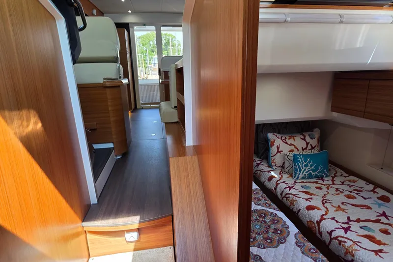 Slide: The Image of Interior of 2023 Greenline 40 yacht with cozy cabin and vibrant bedding. - 33