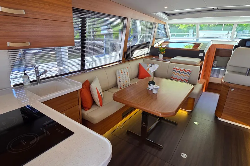Slide: The Image of Luxurious interior of 2023 Greenline 40 yacht with modern kitchen and cozy seating area. - 16
