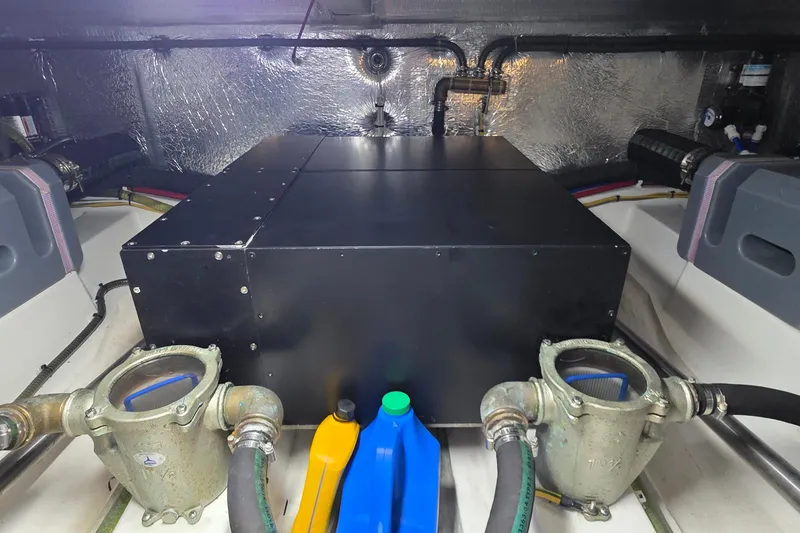 Slide: The Image of Engine room of 2023 Greenline 40 yacht with mechanical components and fluid containers. - 45