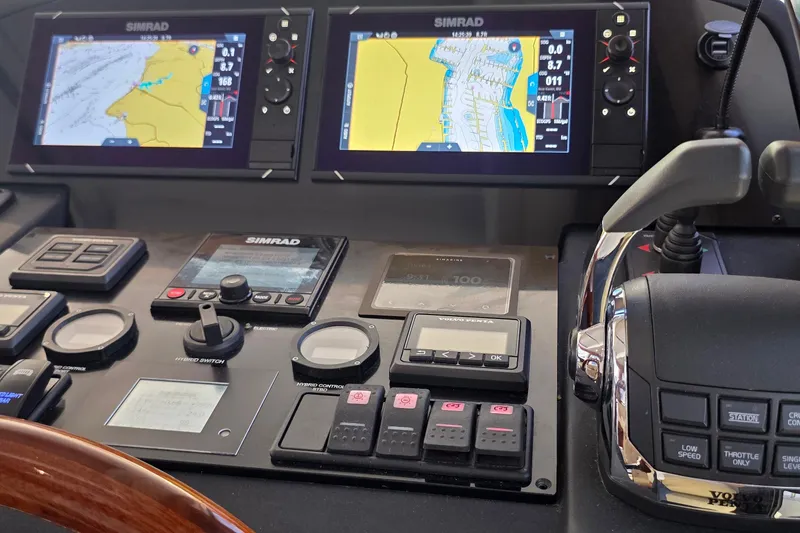 Slide: The Image of Control panel of a 2023 Greenline 40 yacht with dual Simrad navigation displays. - 29