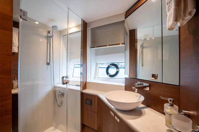 Slide: The Image of Luxurious bathroom in 2023 Princess S66 Sportbridge yacht with modern fixtures and elegant design. - 23