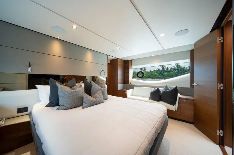 Slide: The Image of Luxurious bedroom interior of 2023 Princess S66 Sportbridge yacht with elegant decor and scenic window view. - 19