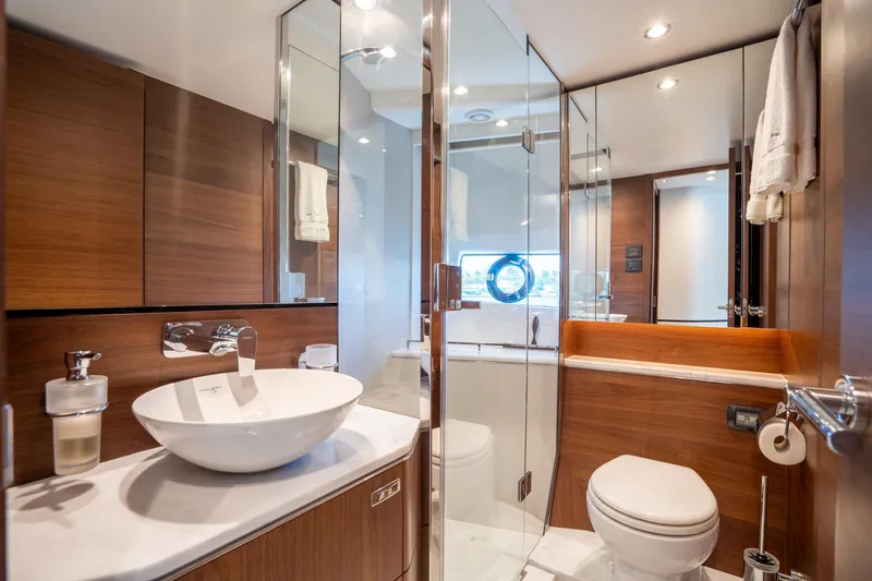 Slide: The Image of Luxurious bathroom in 2023 Princess S66 Sportbridge yacht with modern fixtures and wood accents. - 26