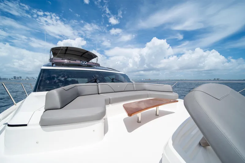 Slide: The Image of 2023 Princess S66 Sportbridge yacht with luxurious seating and ocean view. - 31