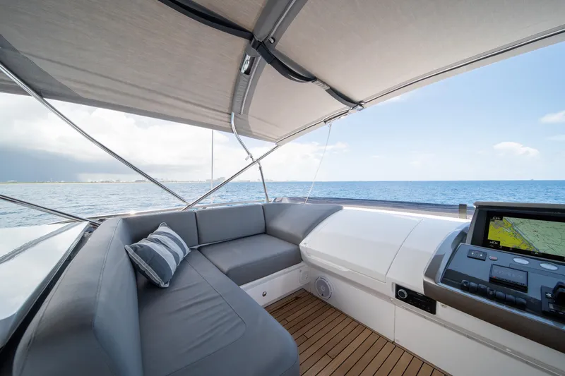 Slide: The Image of Luxurious 2023 Princess S66 Sportbridge yacht interior with ocean view and navigation system. - 27