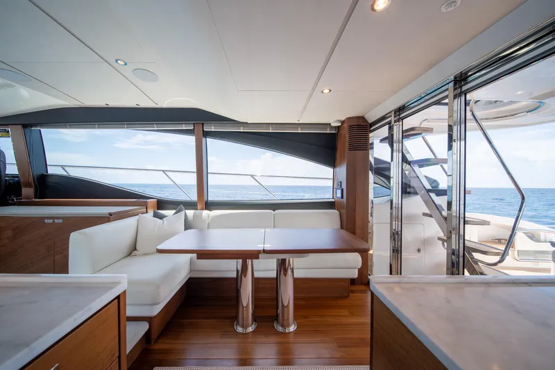 Slide: The Image of Luxurious interior of 2023 Princess S66 Sportbridge yacht with ocean view and elegant seating. - 8