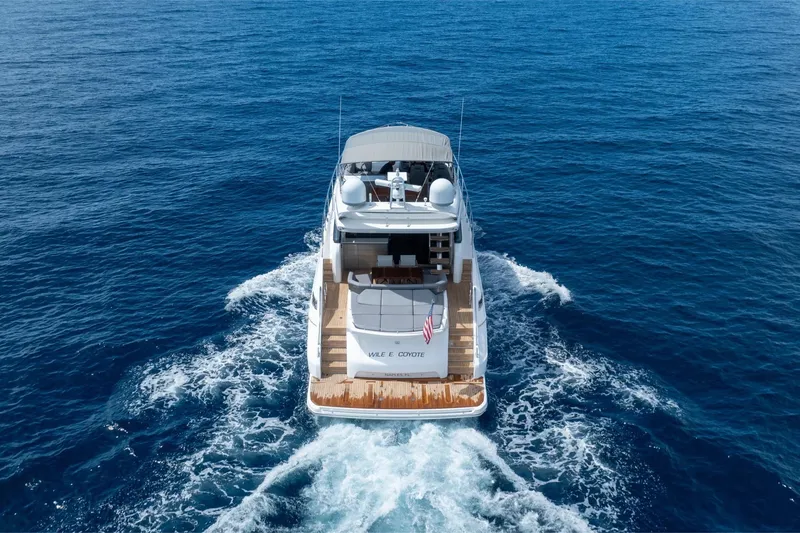 Slide: The Image of 2023 Princess S66 Sportbridge yacht cruising on open blue sea. - 36