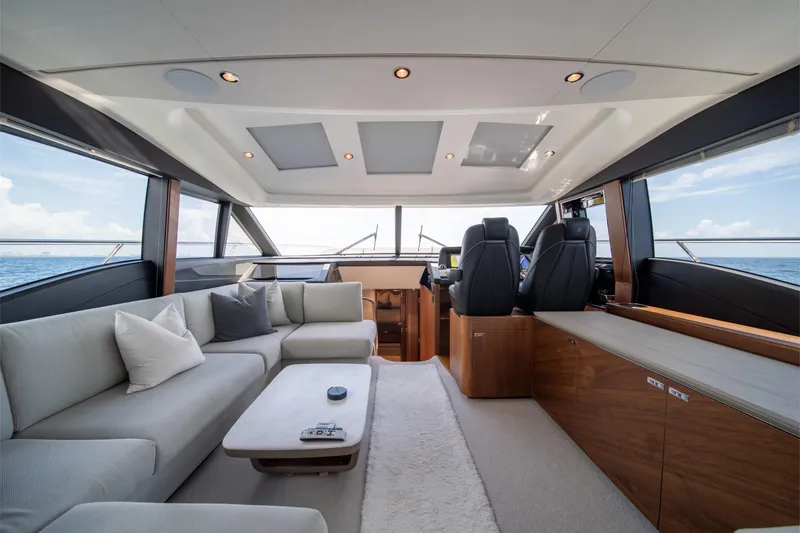 Slide: The Image of Luxurious interior of 2023 Princess S66 Sportbridge yacht with modern seating and panoramic views. - 14