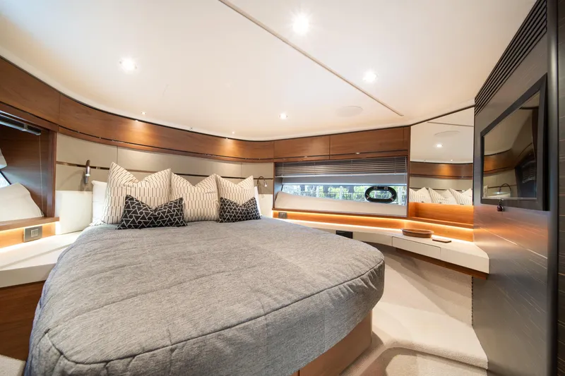 Slide: The Image of Luxurious interior of 2023 Princess S66 Sportbridge yacht with elegant bedding and modern design. - 22
