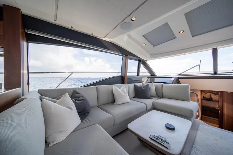 Slide: The Image of Luxurious interior of 2023 Princess S66 Sportbridge yacht with elegant seating and ocean view. - 13