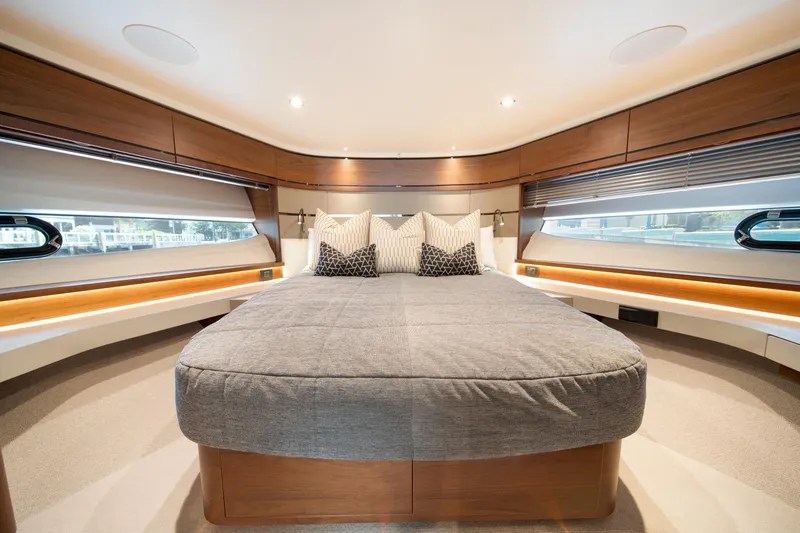 Slide: The Image of Luxurious bedroom interior of 2023 Princess S66 Sportbridge yacht with elegant wood finishes. - 21