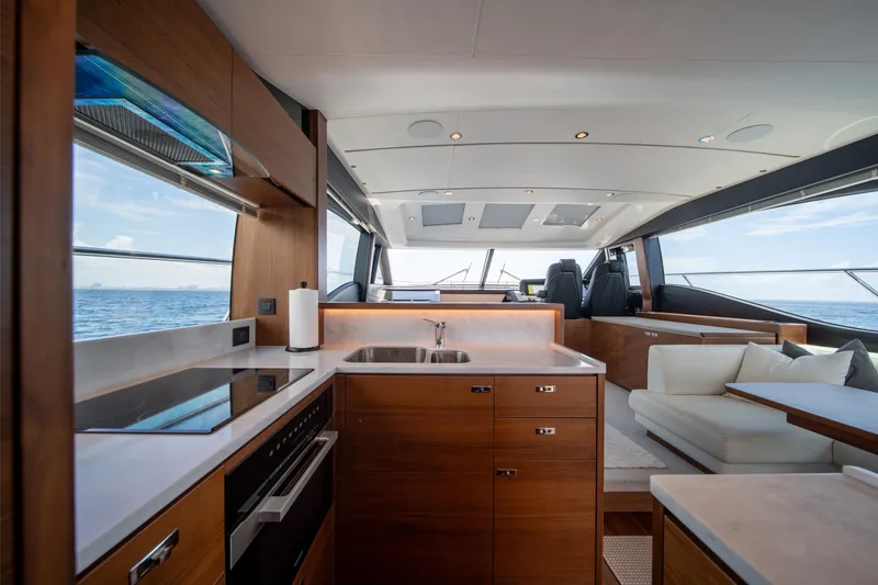 Slide: The Image of Luxurious interior of 2023 Princess S66 Sportbridge yacht with modern kitchen and ocean view. - 11