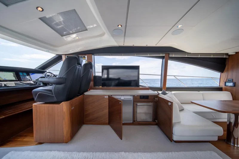 Slide: The Image of Luxurious interior of 2023 Princess S66 Sportbridge yacht with leather seating and ocean view. - 15