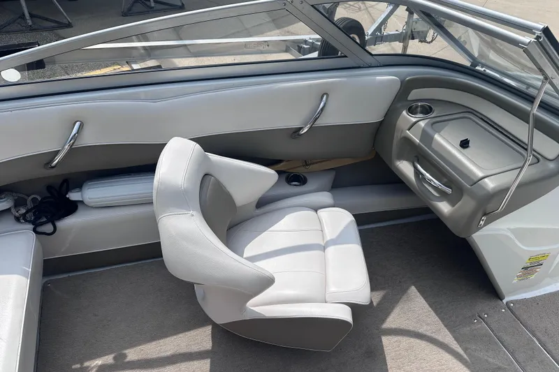 Slide: The Image of Interior of a 2015 Crownline 21 SS boat, featuring sleek seating and modern design. - 11