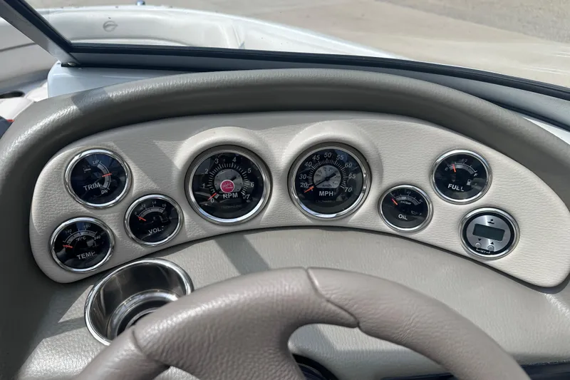 Slide: The Image of Dashboard of a 2015 Crownline 21 SS boat with various gauges and controls. - 15