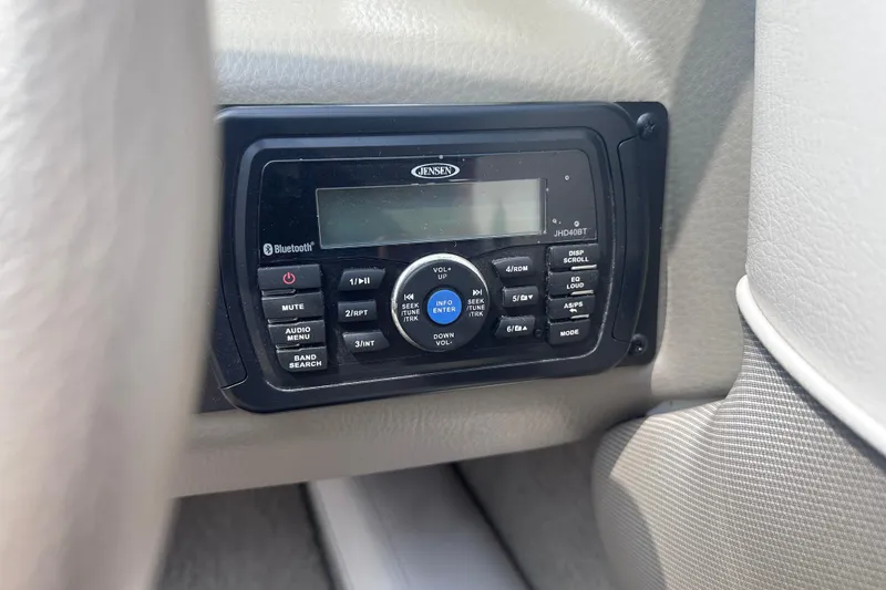 Slide: The Image of Jensen Bluetooth stereo system in 2015 Crownline 21 SS boat interior. - 17