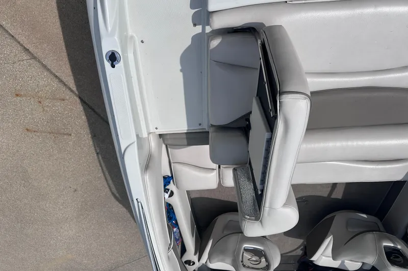 Slide: The Image of Interior of a 2015 Crownline 21 SS boat with gray and white seating. - 9