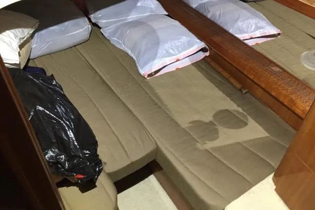 Slide: The Image of Interior cabin of 2004 Carver 420 Mariner with twin beds and pillows. - 11