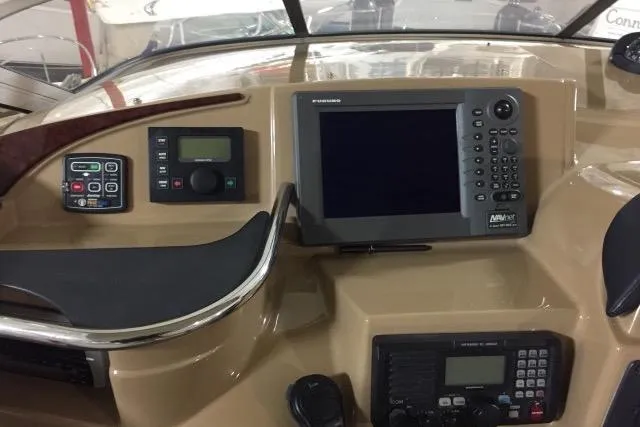 Slide: The Image of Control panel of a 2004 Carver 420 Mariner yacht with navigation equipment. - 16