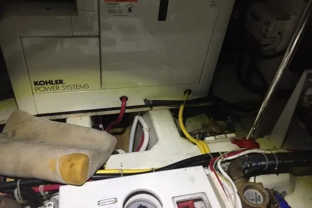 Slide: The Image of Engine room of 2004 Carver 420 Mariner with Kohler power systems and wiring. - 21