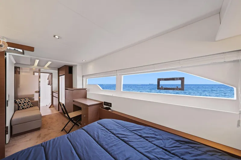 Slide: The Image of Luxurious interior of 2025 Leopard 53 Powercat yacht with ocean view through large windows. - 19
