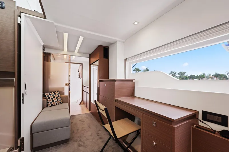 Slide: The Image of Luxurious interior of 2025 Leopard 53 Powercat yacht with modern furnishings and large window view. - 20