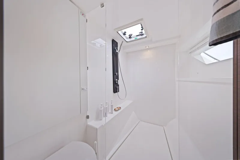 Slide: The Image of Modern bathroom interior on 2025 Leopard 53 Powercat yacht, featuring sleek design and skylight. - 23