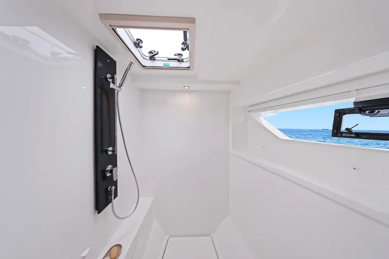 Slide: The Image of Modern shower area on 2025 Leopard 53 Powercat yacht with ocean view. - 24