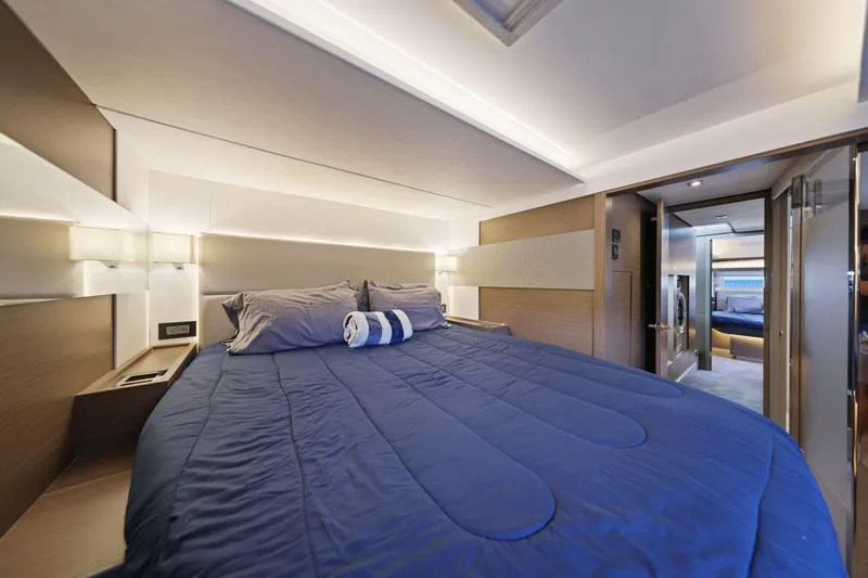 Slide: The Image of Luxurious bedroom interior of 2025 Leopard 53 Powercat yacht with modern design and cozy bedding. - 28