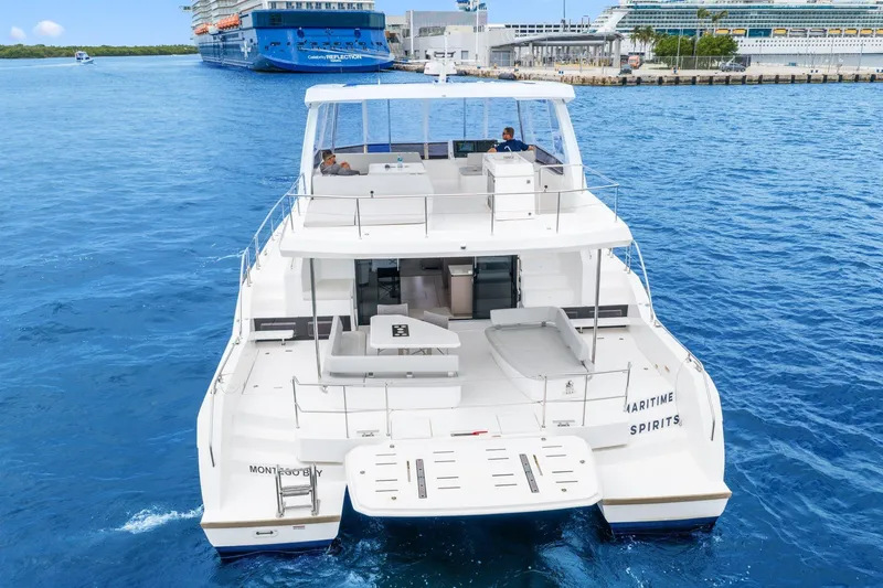 Slide: The Image of 2025 Leopard 53 Powercat yacht on blue ocean near cruise ships. - 3