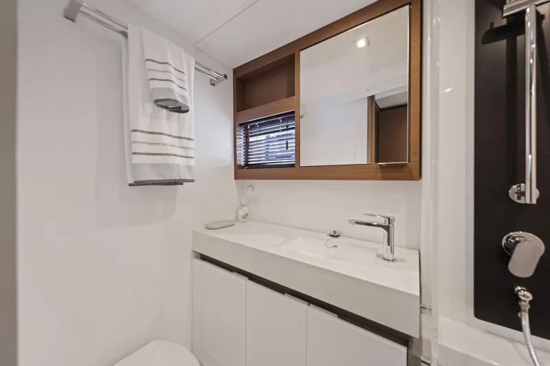 Slide: The Image of Modern bathroom interior on 2025 Leopard 53 Powercat yacht, featuring sleek sink and mirror. - 30