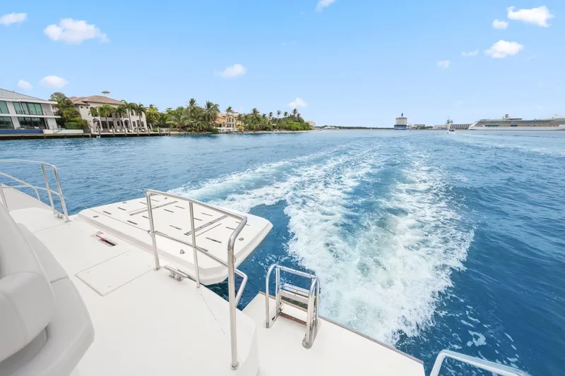 Slide: The Image of 2025 Leopard 53 Powercat cruising on a sunny day, leaving a wake behind. - 38