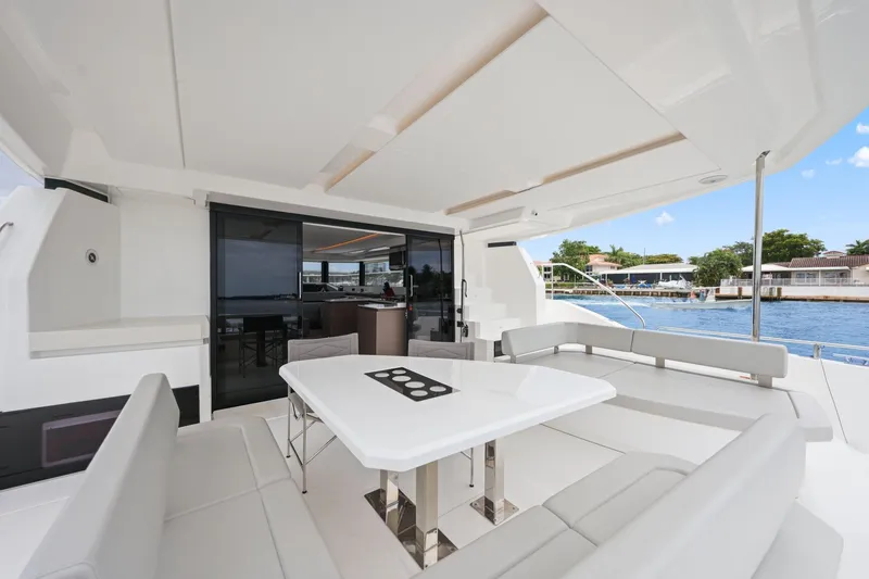 Slide: The Image of Luxurious 2025 Leopard 53 Powercat yacht with spacious outdoor seating and dining area. - 39