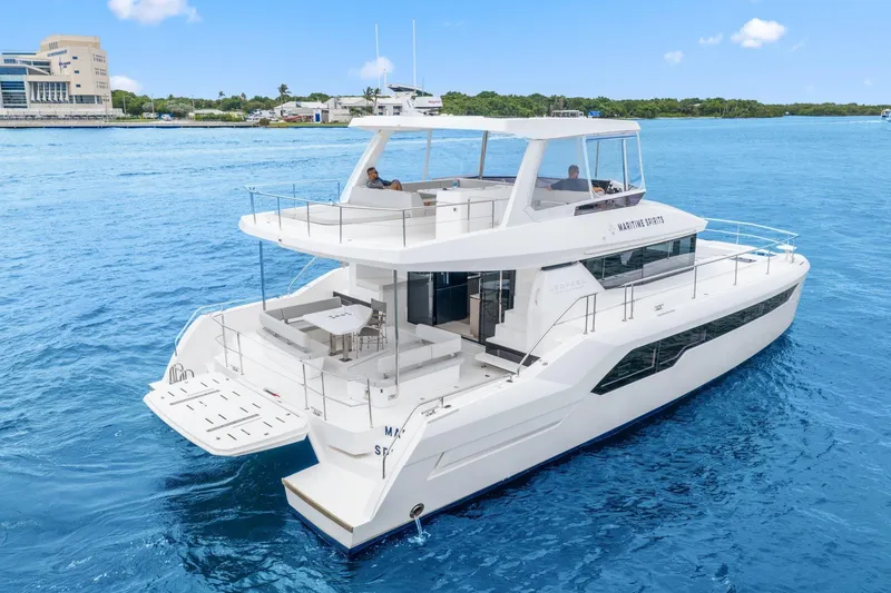 Slide: The Image of 2025 Leopard 53 Powercat yacht cruising on clear blue waters. - 4