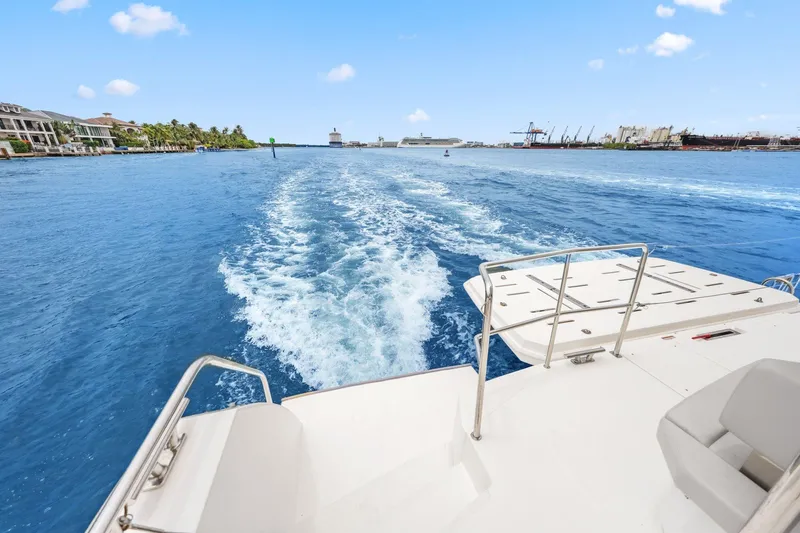 Slide: The Image of 2025 Leopard 53 Powercat cruising on blue waters, leaving a wake behind. - 42