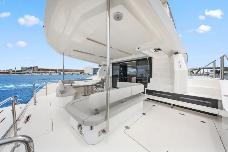 Slide: The Image of 2025 Leopard 53 Powercat yacht deck with modern seating and ocean view. - 43