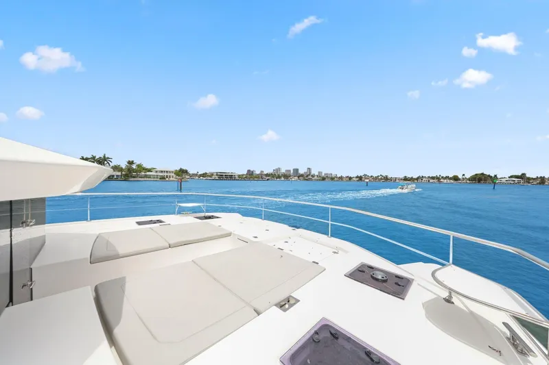Slide: The Image of 2025 Leopard 53 Powercat yacht deck with ocean view and clear blue sky. - 47