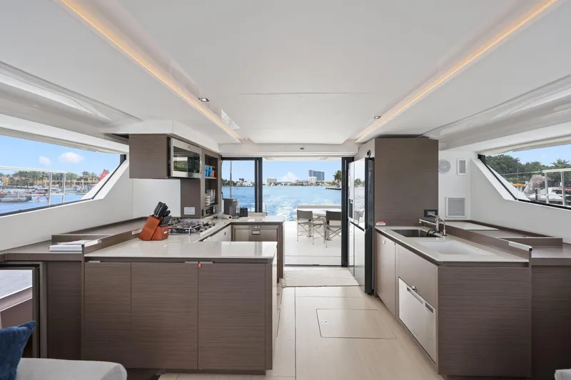 Slide: The Image of Luxurious interior of 2025 Leopard 53 Powercat yacht with modern kitchen and scenic ocean view. - 48
