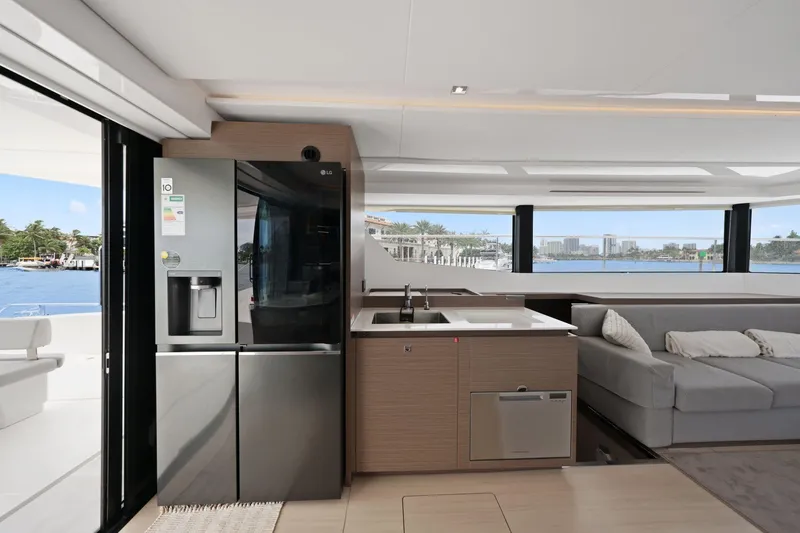 Slide: The Image of Luxurious interior of 2025 Leopard 53 Powercat yacht with modern kitchen and seating area. - 51
