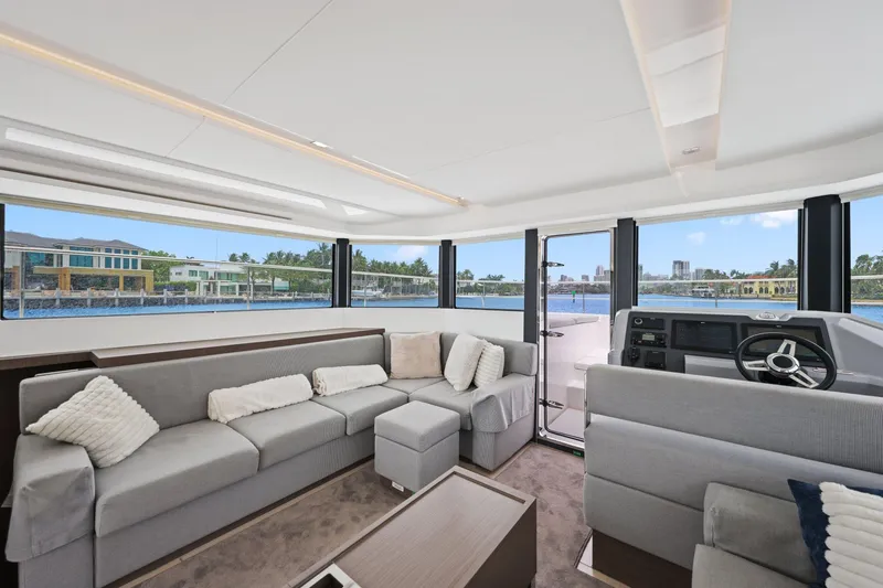 Slide: The Image of Luxurious interior of 2025 Leopard 53 Powercat yacht with panoramic windows and modern seating. - 56