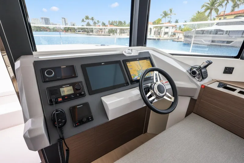 Slide: The Image of Helm of 2025 Leopard 53 Powercat with modern navigation and control systems. - 62