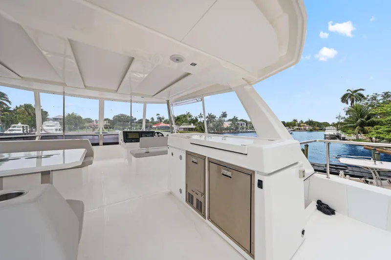 Slide: The Image of Spacious deck of 2025 Leopard 53 Powercat yacht with modern amenities and scenic waterfront view. - 70
