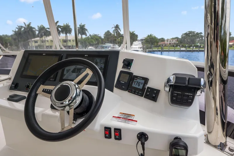 Slide: The Image of Helm of 2025 Leopard 53 Powercat with advanced navigation controls and dual displays. - 81