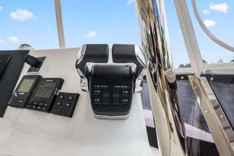 Slide: The Image of Control panel of 2025 Leopard 53 Powercat with throttle and navigation instruments. - 83