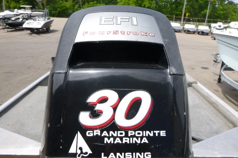 Slide: The Image of EFI FourStroke engine on a 2011 Tracker Pro Angler 16 at Grand Pointe Marina. - 14